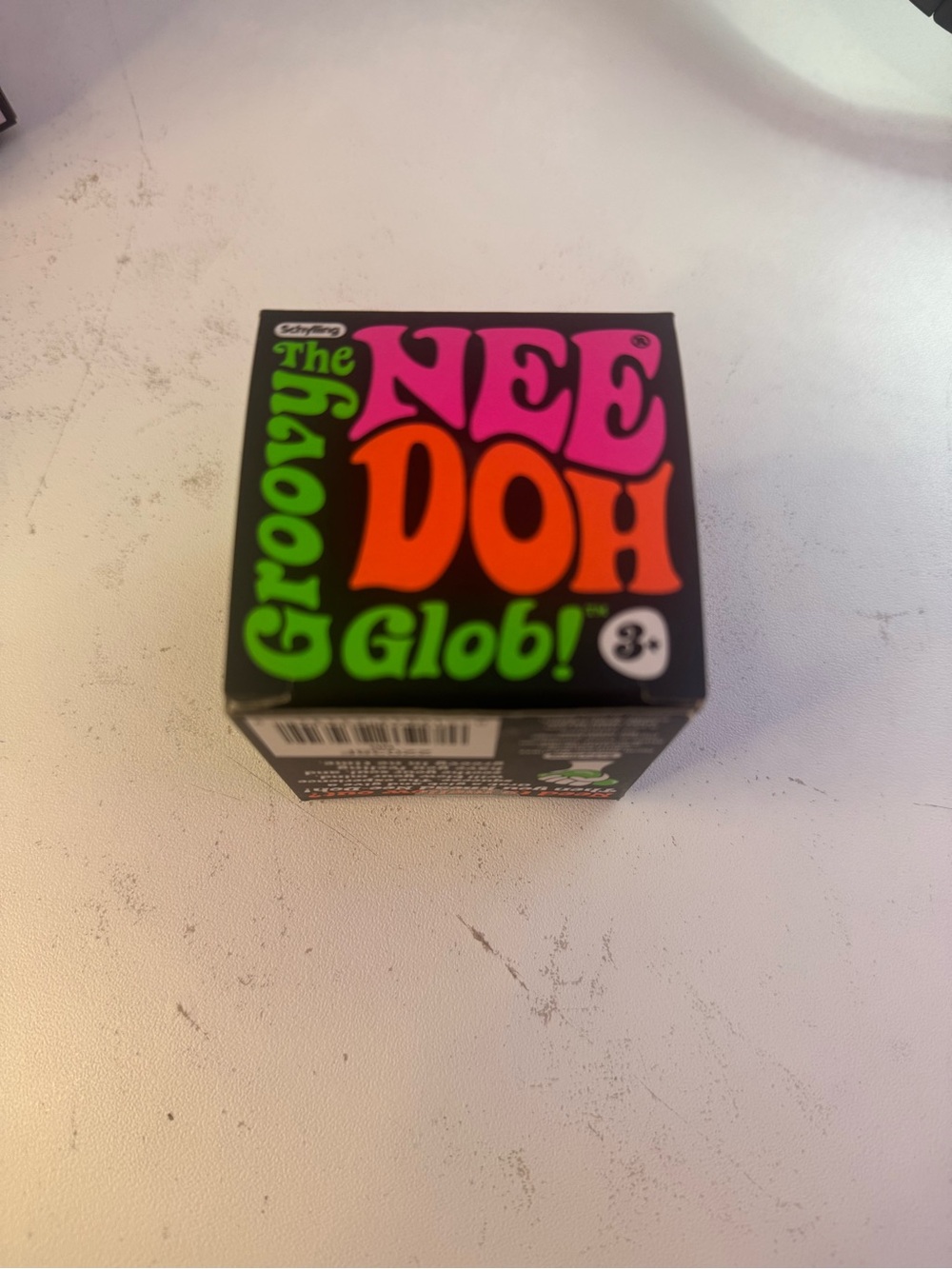 Purple groovy glob NeeDoh